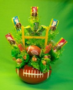 a football themed arrangement with candy and candies