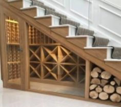 there is a wine rack under the stairs