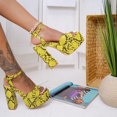 Brand New, Never Been Used Snake Print Heel. These Shoes Feature A Yellow Snake Print, Open Toe With 2” Platform, 4 1/2” Chunky Heel And An Ankle Strap. These Heels Are Very Trendy And Gives Me 70’s Vibes. They Pair Perfectly With Jeans Or A Black Dress. Shoes Run True To Size For Most. Yellow Platform Heels For Party, Yellow Synthetic Heels With 4-inch Heel, Yellow 4-inch Heel Synthetic Heels, Yellow Open Toe Heels For Party, Yellow Platform High Heels, Yellow Open Toe Heels With 4-inch Heel, Yellow High Heel Party Shoes, Trendy Yellow Wedge Heel Shoes, Trendy Yellow Wedge Heels