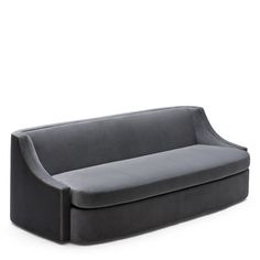 a gray couch sitting on top of a white floor