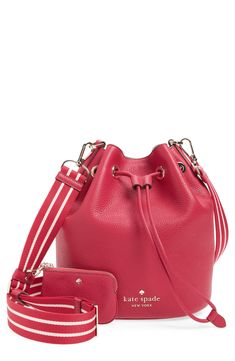 A sporty webbed crossbody strap brings a versatile finish to a pebble-grain leather bucket bag trimmed with glossy grommets. Drawstring top closure Optional, adjustable crossbody strap Lined Leather Imported Casual Leather Bag With Logo Strap, Leather Shopping Bags With Strap, Pink Bags With Logo Strap For Everyday, Pink Everyday Bag With Logo Strap, Drawstring Top, Leather Bucket Bag, Leather Bucket, Crossbody Strap, Kate Spade New York