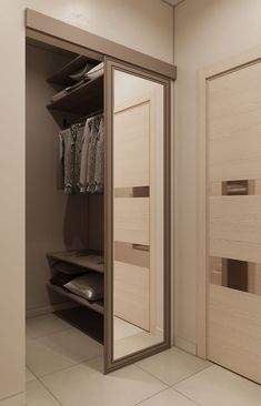 an open closet with mirrored doors and drawers