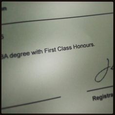 a close up of a paper with the words degree and first class honorarys written on it