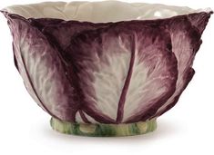 a close up of a purple and white bowl