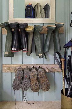 there are many pairs of shoes hanging on the wall