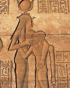 an ancient egyptian relief depicting two men with headscarves and hands on their backs