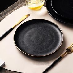 Deluxe Black Ceramic Plates with Gold Edges: A Touch of Elegance for Any Meal Introducing our Deluxe Black Ceramic Plates, the perfect blend of elegance and durability. Crafted from high-quality ceramic, these plates feature a unique matte black finish with antiqued speckling. The gold edges add a luxurious touch, making them the ideal choice for both casual and formal dining. Elevate your table setting and make every meal a special occasion with these exquisite plates. Key Features: High-Qualit Tulip Lamp, Marble Plates, Luxury Plates, Cosmetic Shop, Home Decor Sale, Fine Ceramic, Large Plates, Black Plates, Small Plates