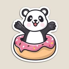 a panda bear sitting on top of a donut