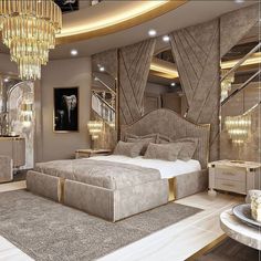 a large bed sitting in the middle of a bedroom next to a chandelier