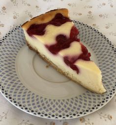 a slice of cheesecake on a blue and white plate