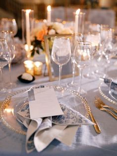 the table is set with silverware and place settings for an elegant dinner party or special event