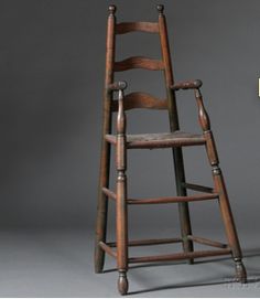 an old wooden step stool next to a sign that says, the ladder is made out of wood