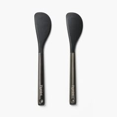 two black spatulas sitting next to each other