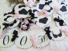 the table is covered with black and white paper cutouts that spell out the initials