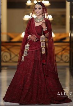 a woman in a red bridal gown