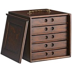 a wooden drawer with five drawers and two doors on the front, one door open