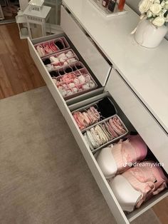 the drawers are open to show baby's clothes