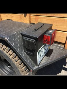 the back end of a truck with a box on it