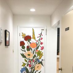 a white door with flowers painted on it