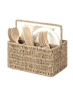 a wicker basket with plates and utensils in it