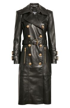 Gleaming crest-embellished buttons bring military polish to this lambskin leather coat that borrows iconic elements from both biker and trench styles. 44 1/2" length (size 4 US / 36 FR) Double-breasted button closure Notched lapels with hook-and-eye throat latch Belted cuffs Front zip pockets Epaulets Gun flaps Storm flap Removable belt Leather Lined Professional leather clean Made in Turkey Women's Designer Clothing Classy Winter Coat, Faux Leather Coat, Outfit Check, Leather Trench Coat, Trench Coats Women