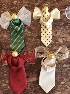 four different colored ties with gold balls and bows on them, all tied up together