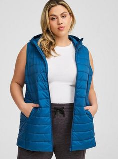 FIT Model is 5'9” wearing size 1. Measures 32” from shoulder (size 2). MATERIALS + CARE Cotton-blend fabric. . 100% nylon. Machine wash cold. . Imported. DETAILS Collared neckline. . Sleeveless. . Zip front. . The best plus size women's light packable puffer vest vests in blue opal made of nylon. Torrid is your destination for cozy fall and winter clothes to keep you warm and comfortable. Winter Puffer Vest, Black Dating, Casual Outerwear, Casual Vest, Long Torso, Winter Clothes, Puffer Vest, Cozy Fall, Blue Opal