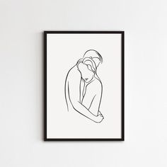 a black and white drawing of two people hugging