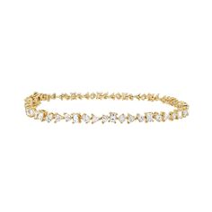 A untraditional take on a classic piece, the tennis bracelet. This iconic bracelet is crafted in a multi-shape scattered diamond style, featuring fancy-cut baguette, trillion, pear, oval, and round diamonds. An instant heirloom to wear and pass down for generations to come. 6.8GMS Solid 14K Gold and 4.45CT Diamonds Length: 7.25" Kimberley Certified Diamonds (Conflict Free) Timeless Baguette Diamond Wedding Bracelet, Timeless Wedding Diamond Bracelet With Baguette Diamonds, Timeless Wedding Tennis Bracelet With Baguette Diamonds, Elegant Formal Bracelets With Marquise Cut, Timeless Baguette Diamond Tennis Bracelet For Weddings, Elegant Marquise Cut Bracelets For Formal Occasions, Luxury Wedding Bracelet With Marquise Cut, Luxury Wedding Bracelet, Marquise Cut, Luxury Marquise Cut Wedding Bracelets