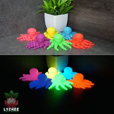 there is a potted plant next to some neon colored plastic octopus figures on the floor