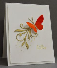 a close up of a greeting card with a butterfly on the front and an orange flower on the back