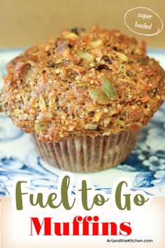 a close up of a muffin on a plate with the words fuel to go muffins