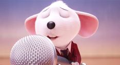 a cartoon mouse holding a microphone with his eyes closed