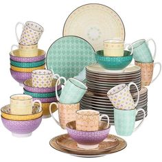 an assortment of dishes and cups are stacked on top of each other