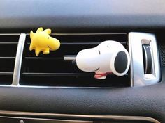 a car air vent with a cartoon dog on it