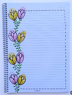 a notebook with flowers painted on it and lined paper in the bottom corner, next to an empty notepad