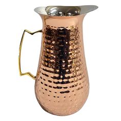 a copper colored pitcher with a metal handle