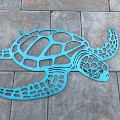 a sea turtle cut out on the ground