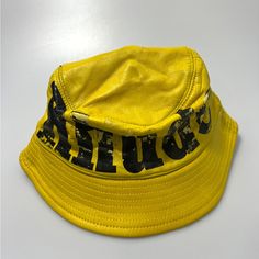 Rhude Logo Leather Bucket Hat Yellow Black $765. Pre-Owned And Letters Fading. Premium Leather Bucket Hat Is A Stylish And Practical Accessory Featured In Mustard Yellow With Black Rhude Logo. 100% Leather One Size Fits All Spot Clean With Distilled Soapy Water Leather Bucket Hat, Yellow Hat, Leather Bucket, Mustard Yellow, Yellow Black, Black N Yellow, One Size Fits All, Black Color, Bucket Hat