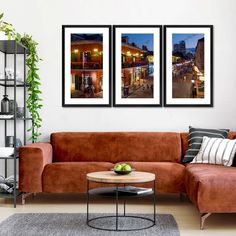 a living room with two pictures hanging on the wall