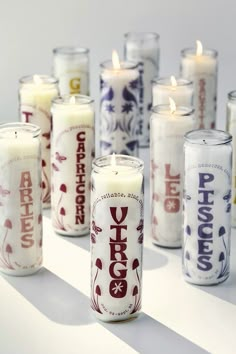 many candles are lined up on a table