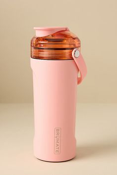 a pink insulated coffee cup with a carafe lid and handle on the side