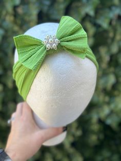 "Light GREEN Pearl BOW HEADBAND --->> MANY COLORS AVAILABLE <<--- Please see link:  https://www.etsy.com/shop/BySophiaBaby/search?search_query=1431&order=date_desc&view_type=gallery&ref=shop_search -->> FREE SHIPPING!! <<-- *BOW HEADBAND DESCRIPTION*: - Unique Handcraft Triple Bow placed on a 2\" stretchy Headband. Bow measure approx. 3.5\"X 2.5\"   - Bow is made of fabric and grosgrain, Bow is very light & headband holds very well on baby's head not leaving any marks. - This Headband is perfect for any occasion, Weddings, Flower Girls or just a day at the park. - Mix & Match with our Bloomers, Tutu Skirt, Barefoot Sandals, Moccasins & Necklaces  :) Please see our shop sections. *SHIPPING INFO*: -  We ship your order from Hawaii,  delivery time is the same to all US states: First Class Mai Headband Photography, Headband Bow, Pearl Bow, Newborn Headband, Stretchy Headbands, Green Pearls, Headband Baby, Newborn Headbands, Baby Head