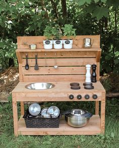 an outdoor kitchen with pots, pans and utensils on the counter top