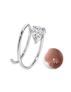 a ring with a heart shaped diamond on the side and an oval noseplug attached to it