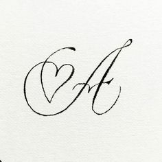 the letter g is inscribed in cursive handwriting with a heart on it's side