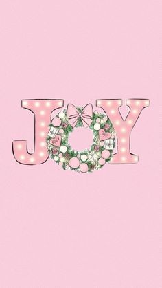 a pink background with the word joy spelled in light up letters and flowers on it