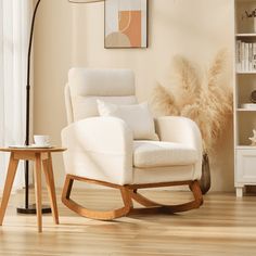 a white rocking chair in a living room