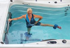 a woman in a bathtub with her arms outstretched and legs bent out, stretching