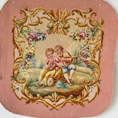 an antique pink and gold frame with two children playing on the ground, surrounded by flowers